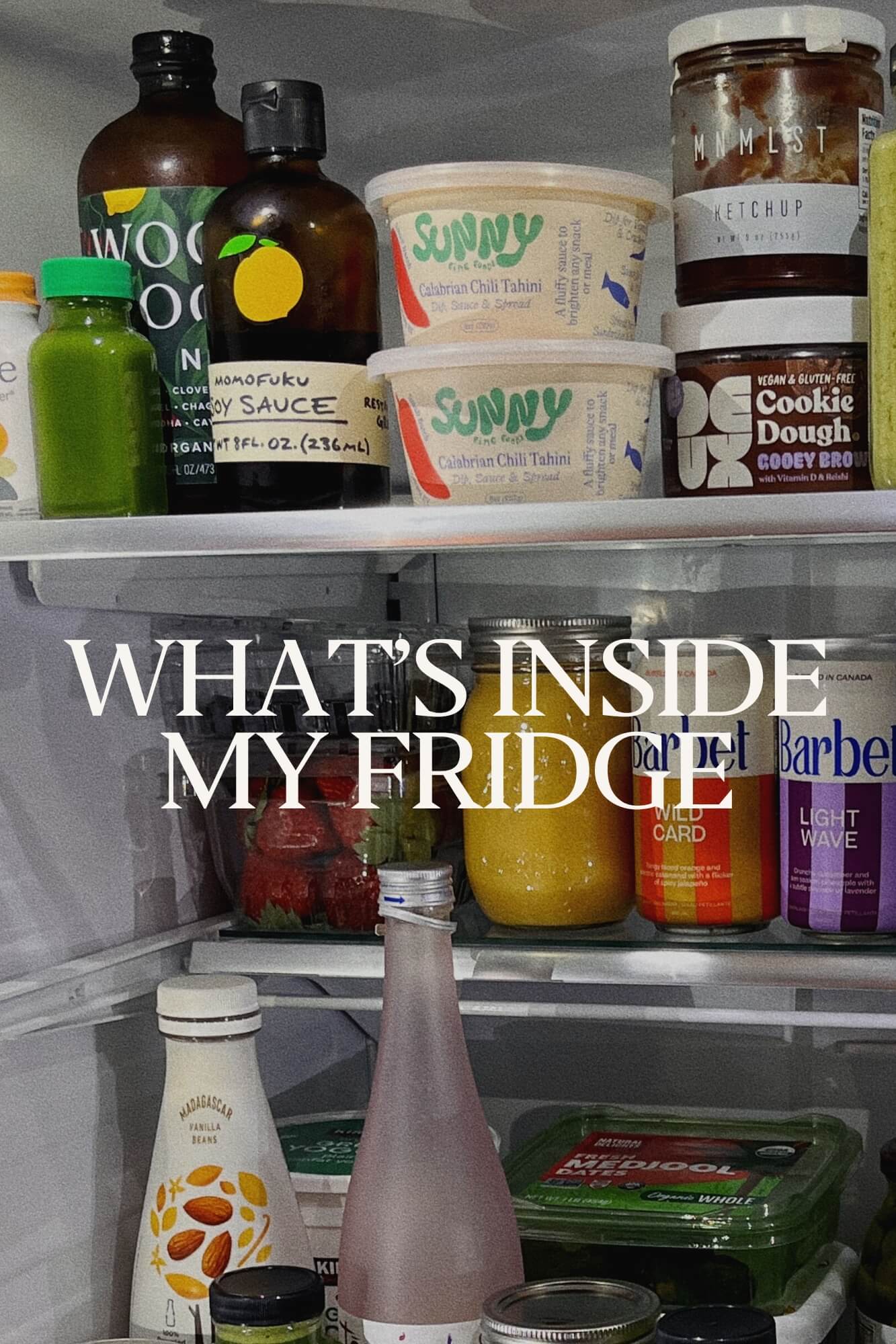 Inside of a gut healthy fridge full of organic foods, non-alcoholic beverages, and Woodroot Tonic. 